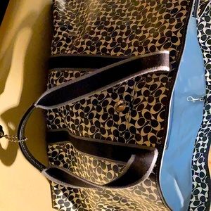 Overnight black and white Coach bag